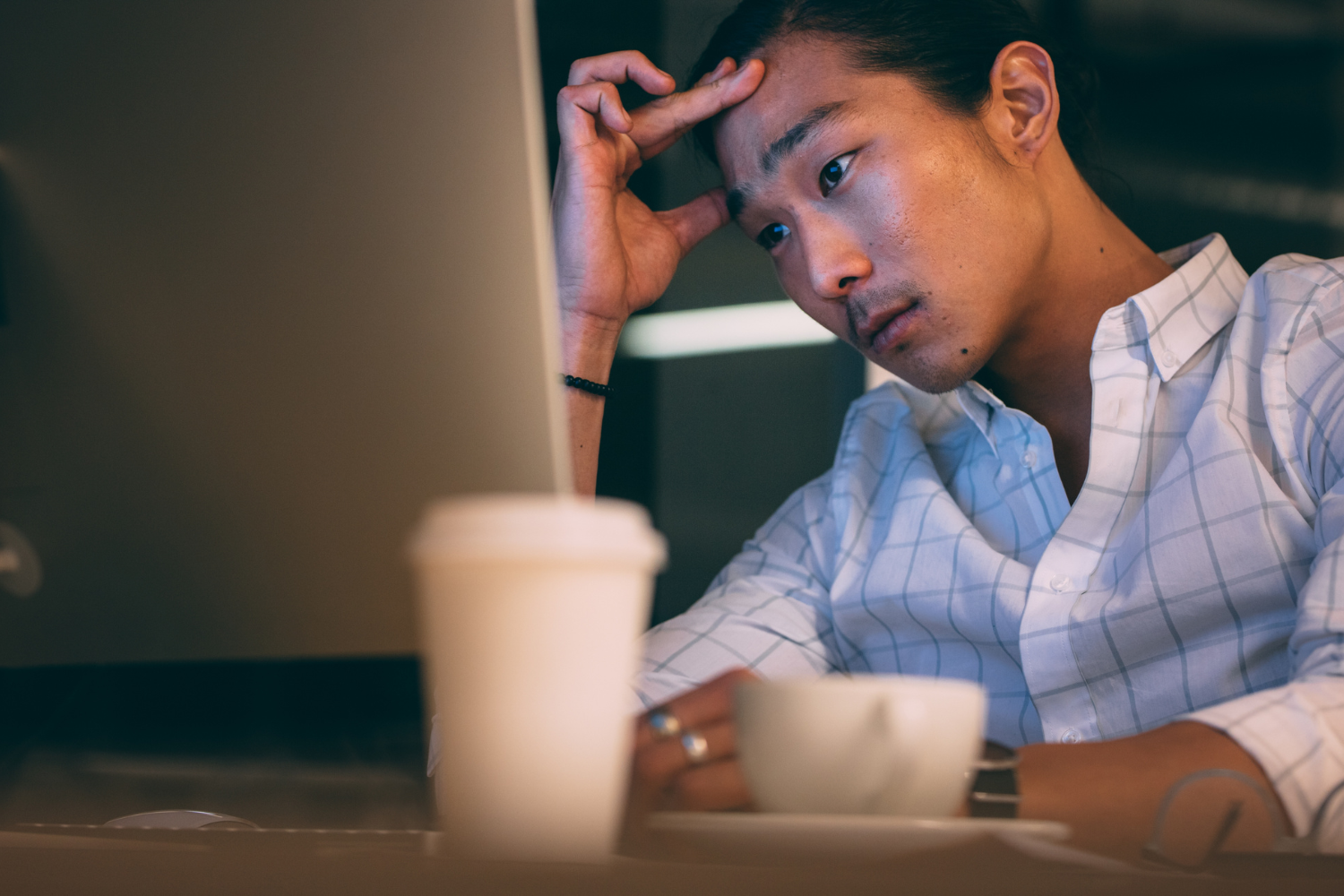 Man looking confused at work.