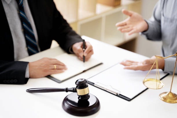 Consultation with a pedestrian accident lawyer, discussing legal options for compensation.