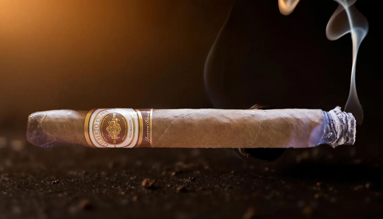A cigar being lit, releasing aromatic smoke in the air.