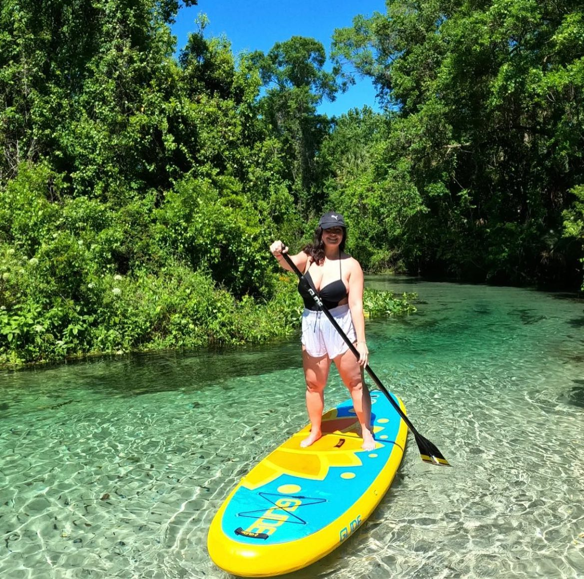 woman holding sup paddle