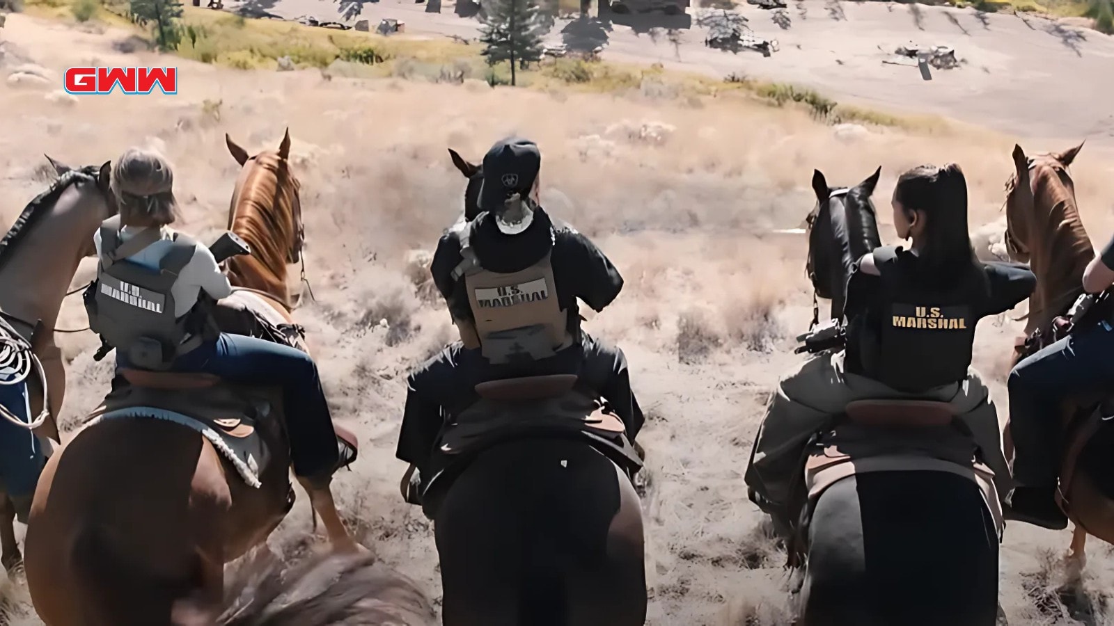 Luke Grimes and Arielle Kebbel ride with U.S. Marshals team