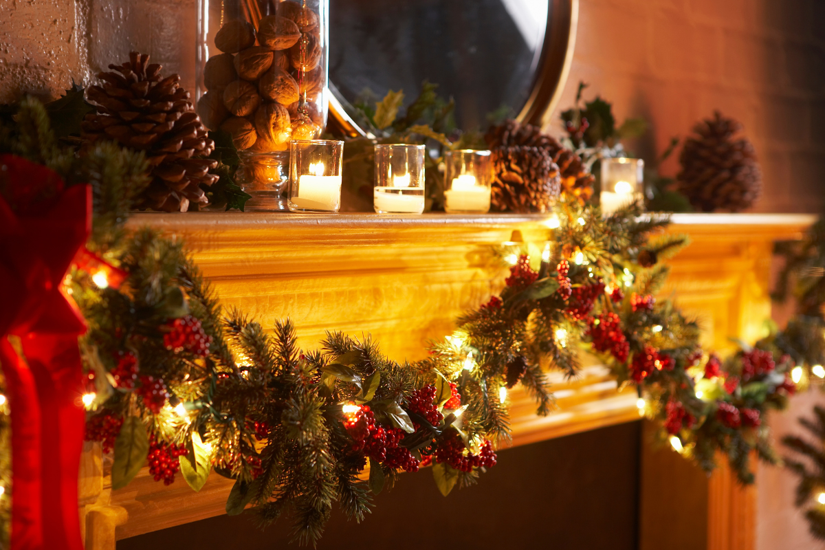 Modern glam christmas mantel decor featuring metallic accents.