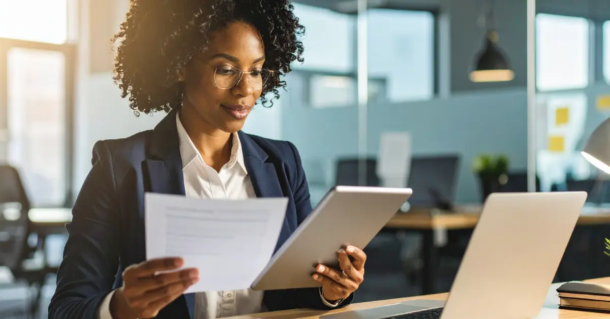Woman reviewing PPV OnlyFans earnings and tracking taxable income.