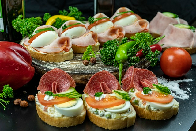 A selection of savory appetizers for a baby shower, including mini sandwiches, canapes, and hors d'oeuvres