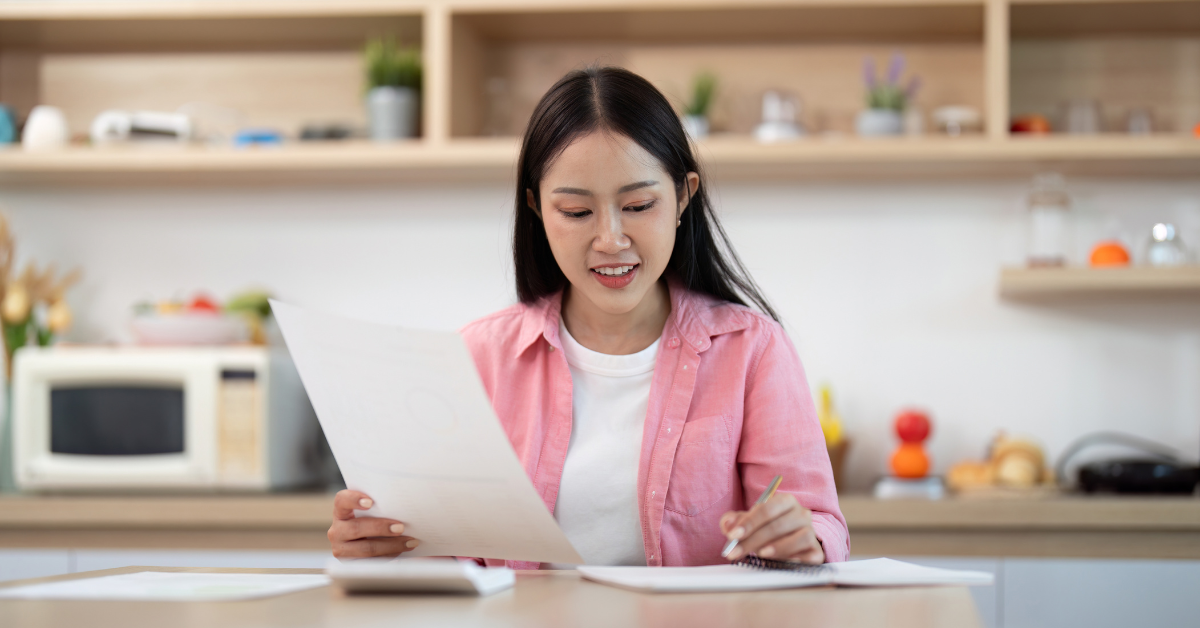 Successful woman reviewing OnlyFans income reports and learning about the most money made on OnlyFans.