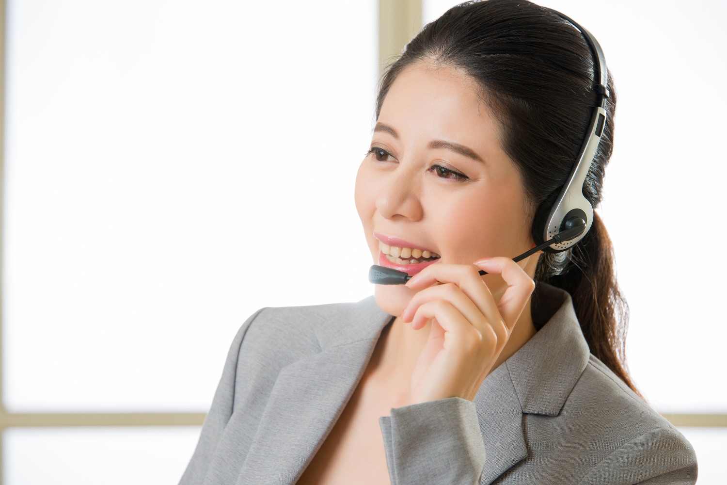 A remote employee speaking through headset.