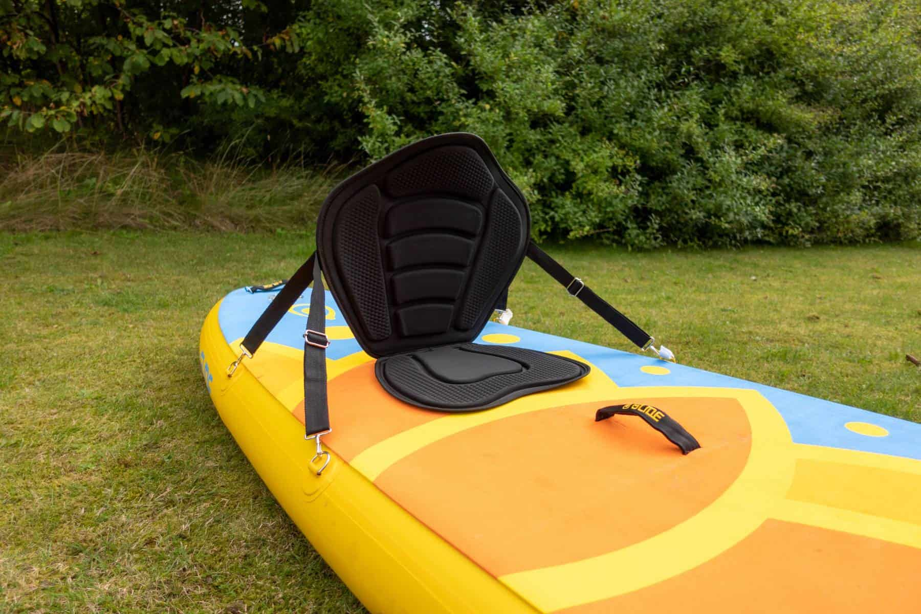 paddle board with a kayak seat on it