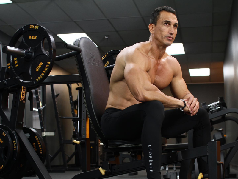 Image of a person using the chest press machine feature to build a stronger chest.