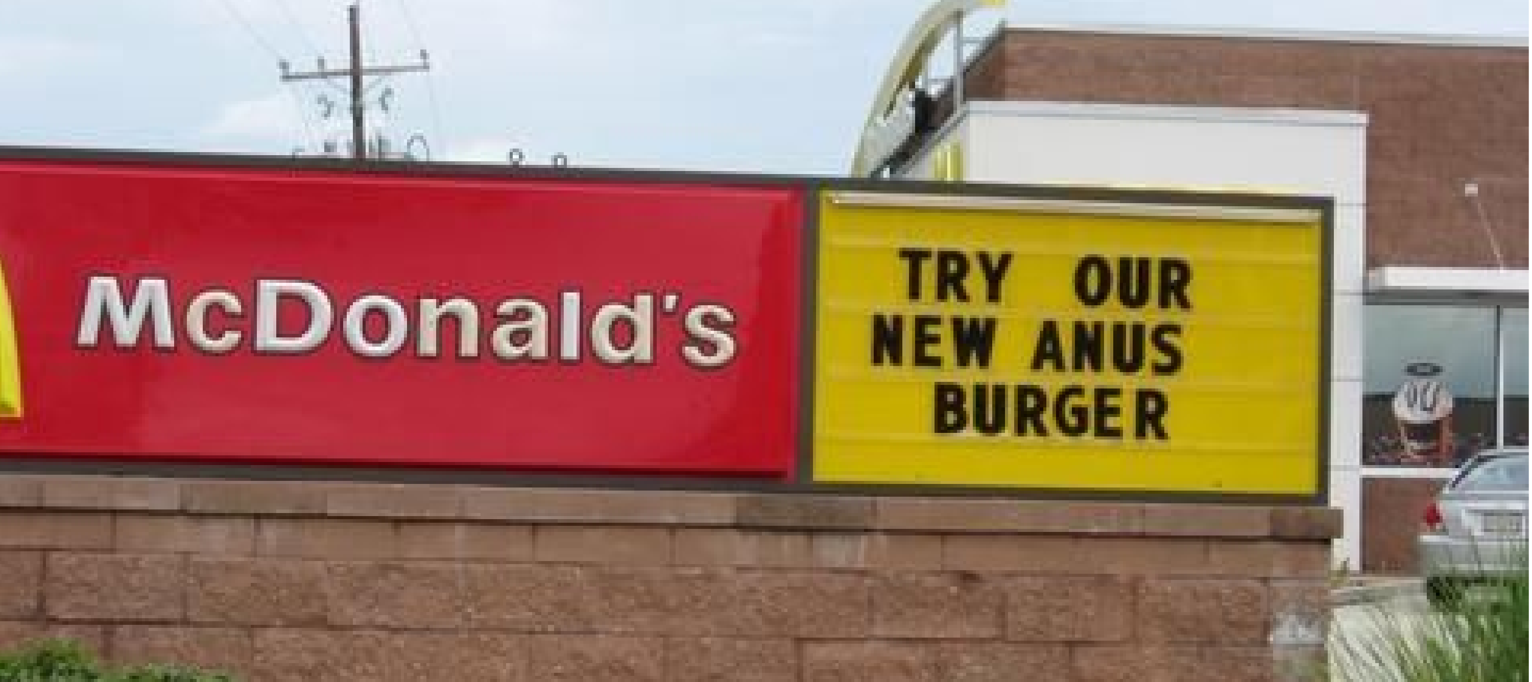 McDonald’s “Try Our New Anus Burger” Typo