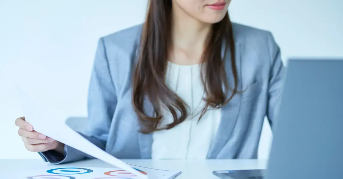 Woman reviewing IRS records for a federal tax lien release.