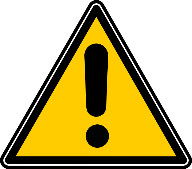 An image of a yellow caution sign symbolizing the need to read the warnings and precautions on a throat spray bottle.
