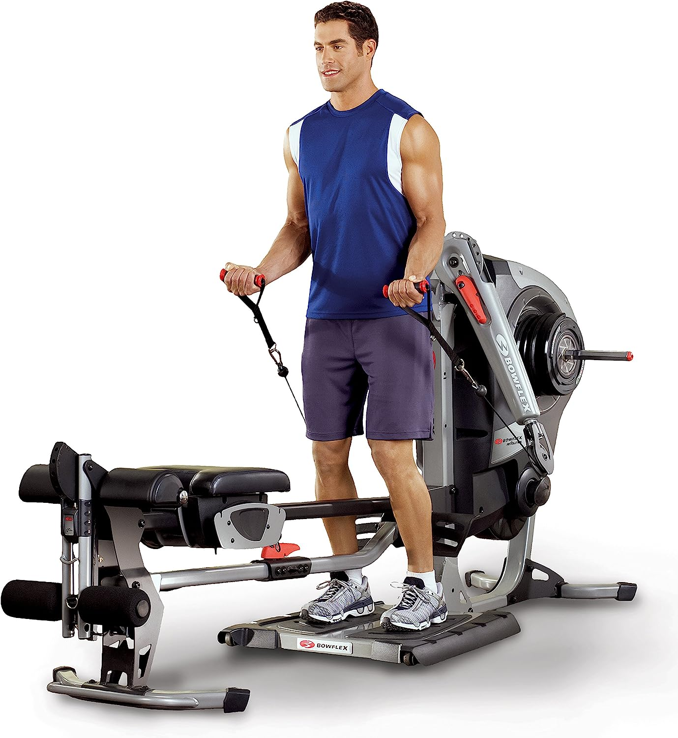A Bowflex home gym machine with a variety of attachments and accessories