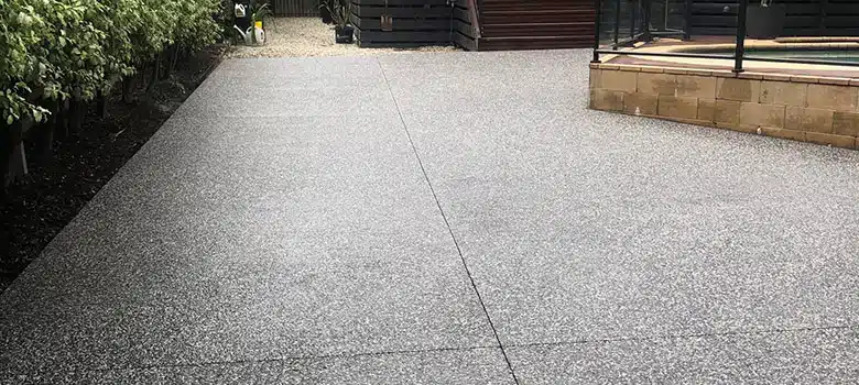 Maintenance of exposed aggregate surface with pressure washer