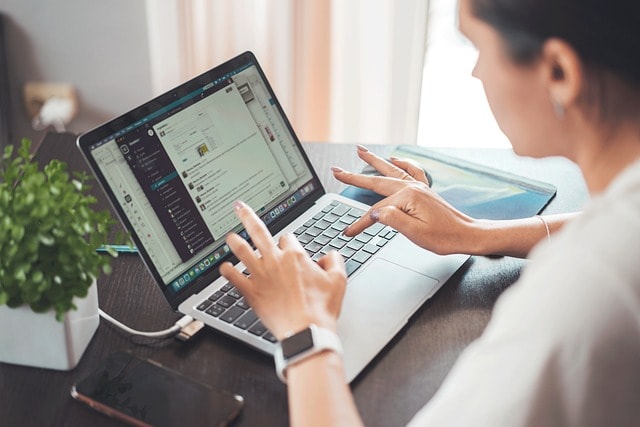 Woman typing on laptop