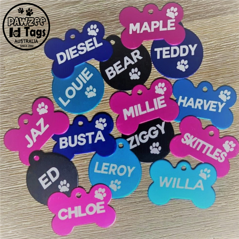 Various personalised dog tags in different shapes and colors
