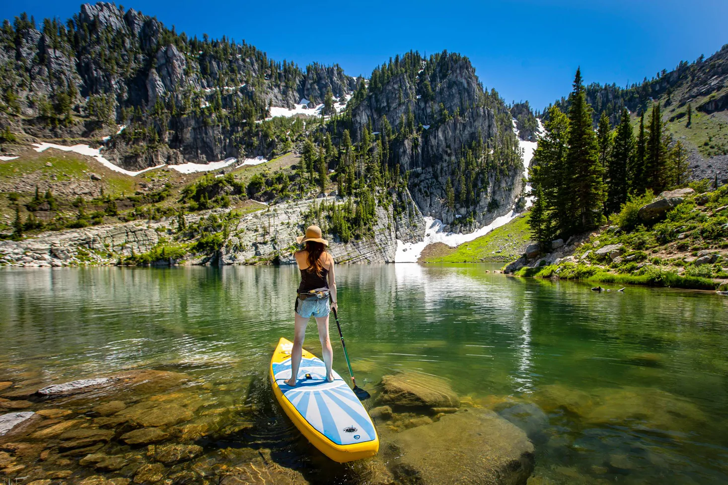 stand up paddle board on a mountain lake