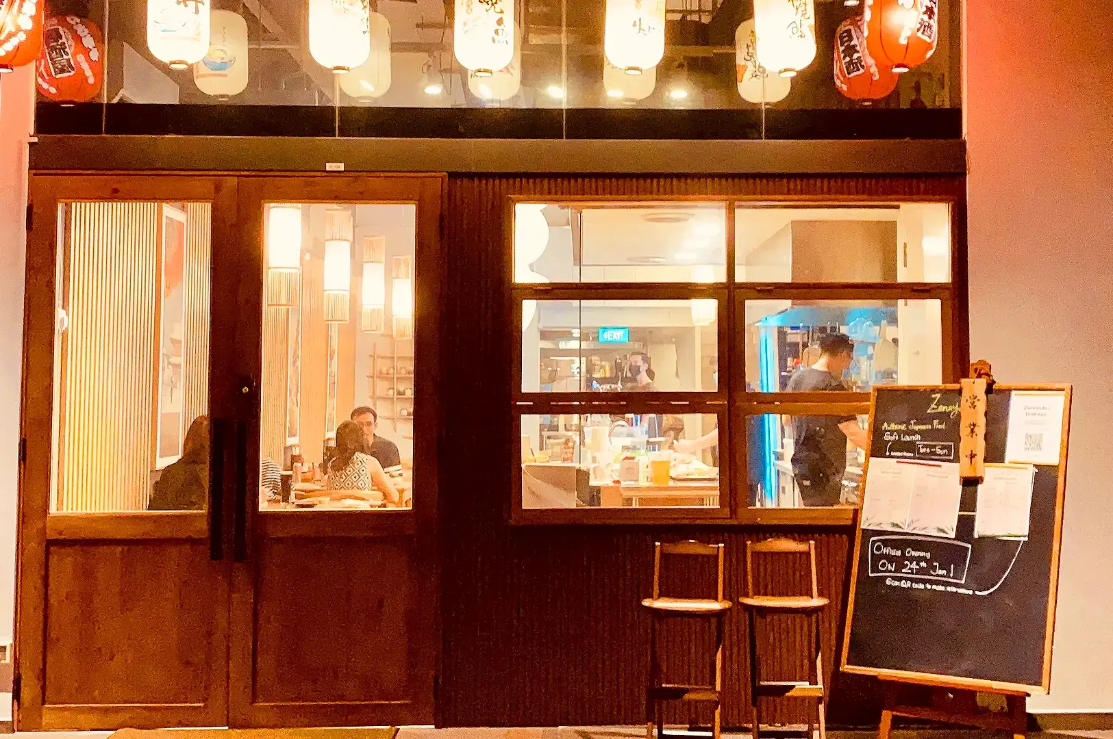 Zenryoku Izakaya Singapore Japanese restaurant interior with traditional lanterns and warm dining atmosphere
