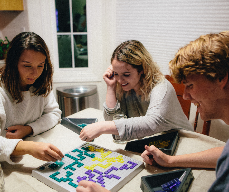 A group of friends playing board games on a game night