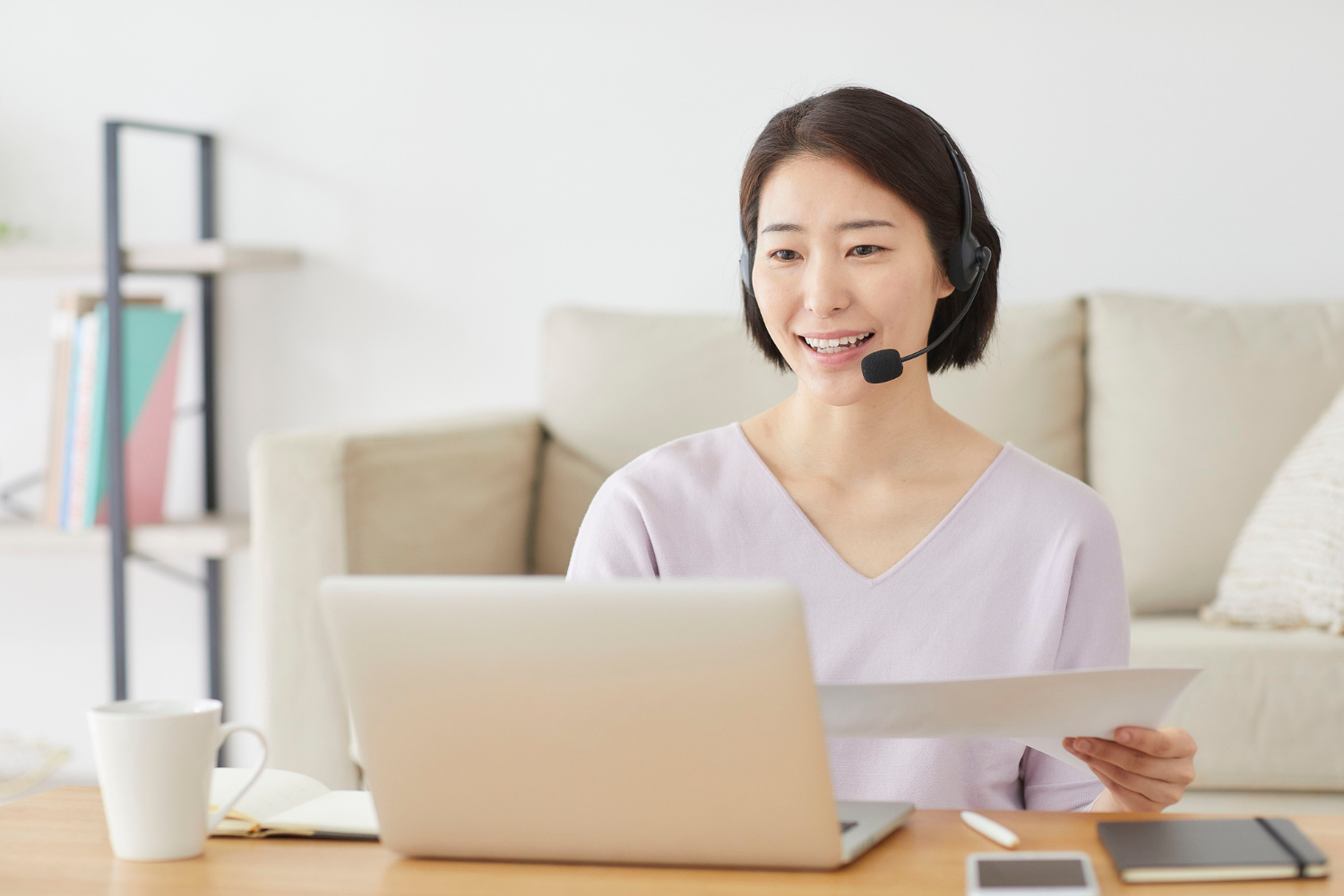 Southeast Asian remote worker on virtual meeting.