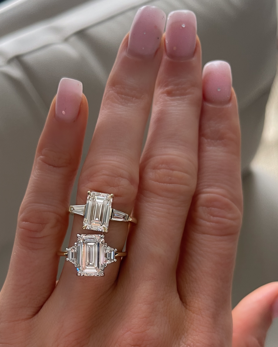 Three Stone engagement rings with Emerald cut diamond