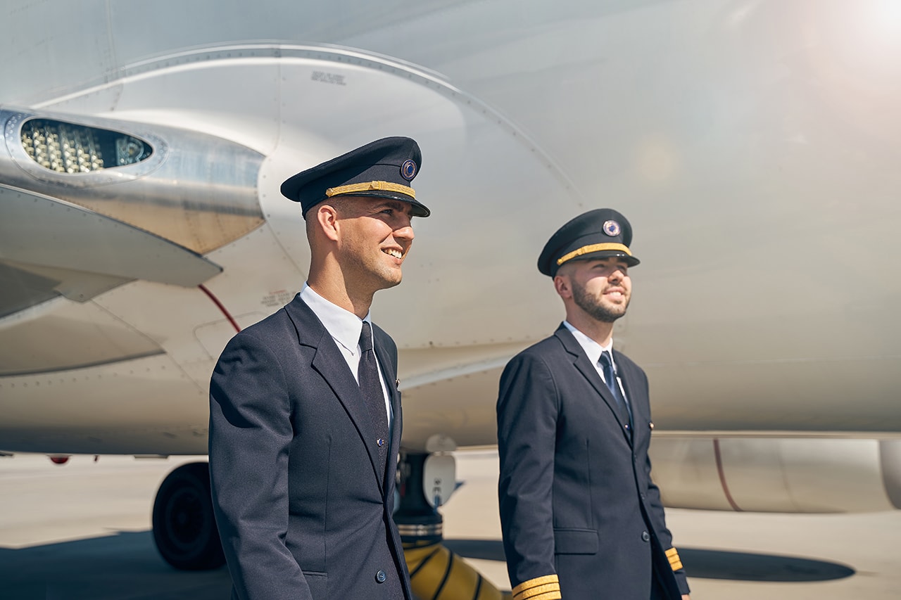 A group of commercial airline pilots discussing career opportunities.