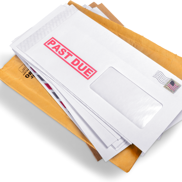 A photograph showing a stack of medical bills from a truck accident.