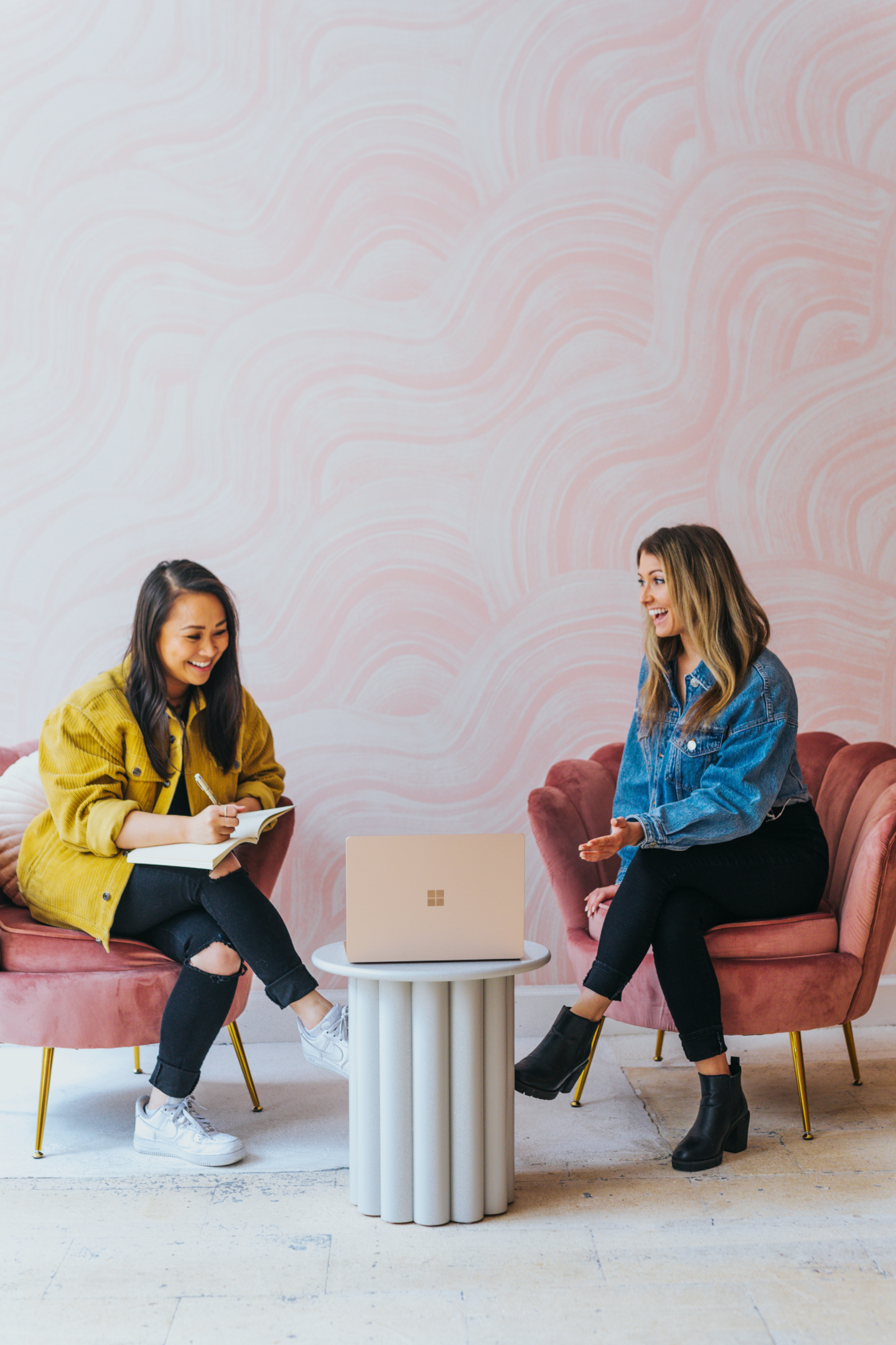 two women talking at work