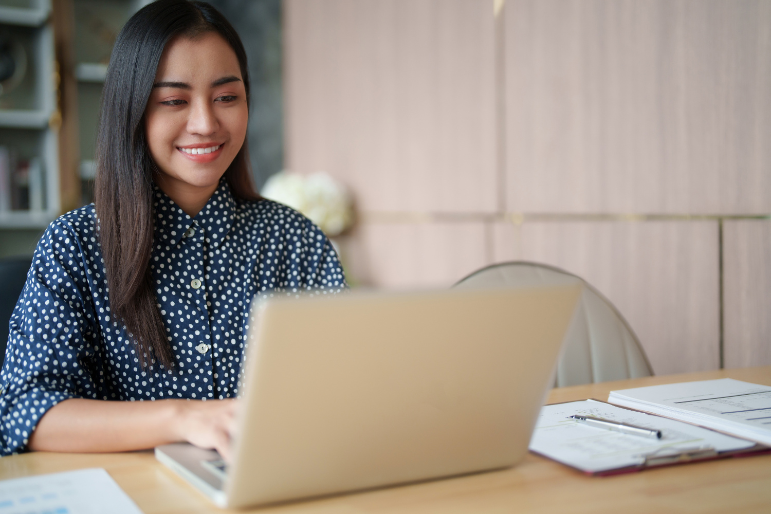 Interviewee smiling on her laptop.