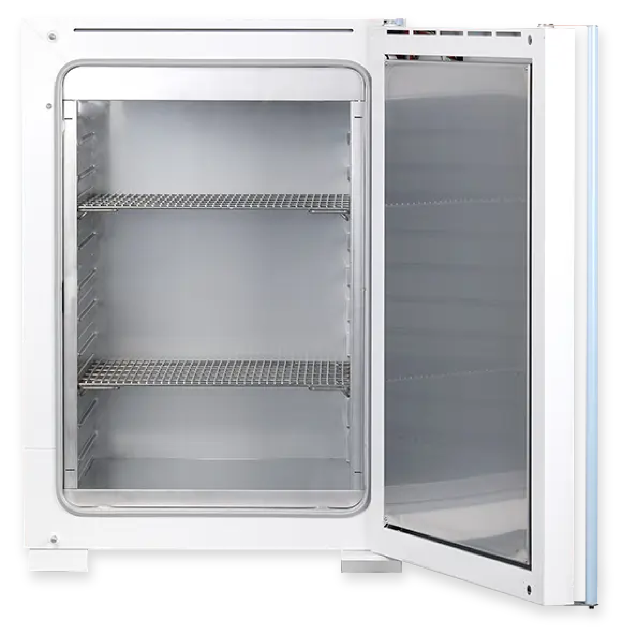 A picture of a gravity convection oven with a stainless steel inner chamber and perforated stainless steel shelves