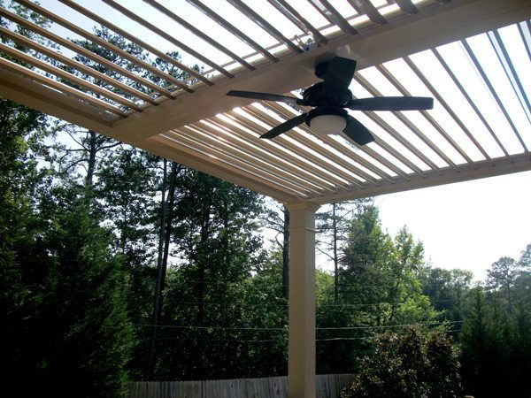 Fan kit attached to center beam on aluminum pergola