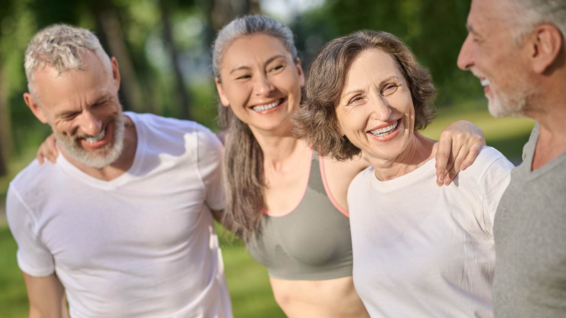 Happy group outdoors, promoting liver detox, liver health, and active lifestyle to combat chronic liver disease and liver damage.