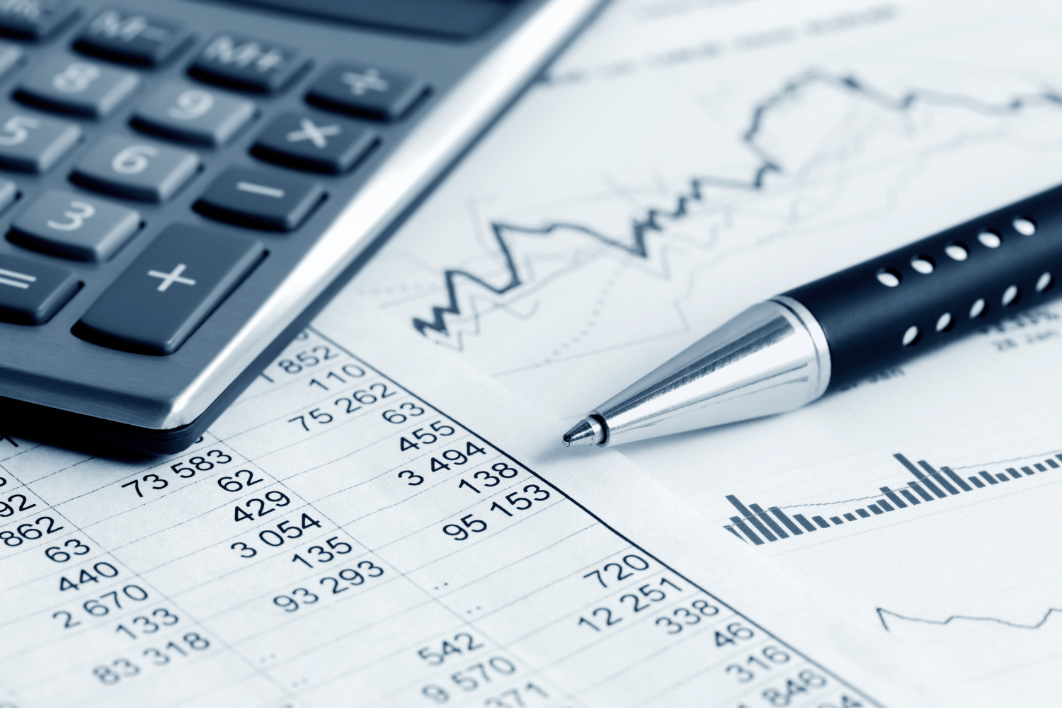 Documents with numbers and a calculator.