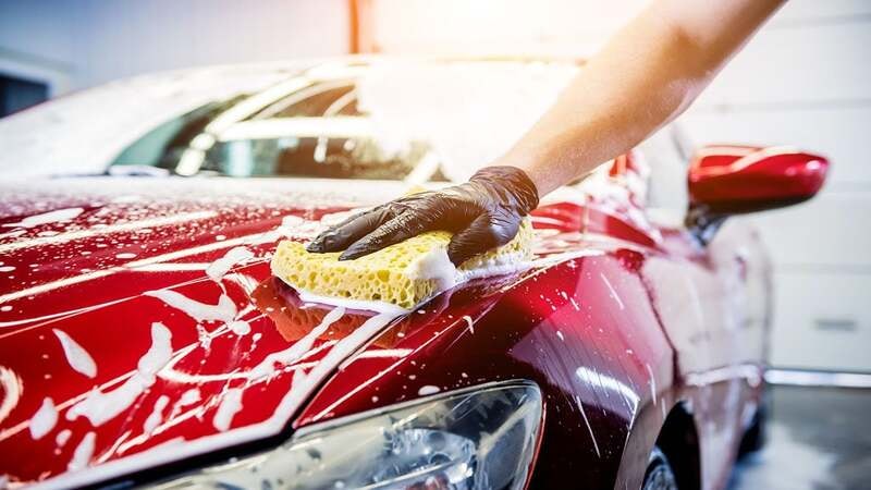 Gentle washing of a red car wrap