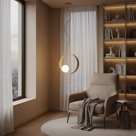Modern ring pendant light creating a warm reading corner in the bedroom beside a lounge chair and shelving.