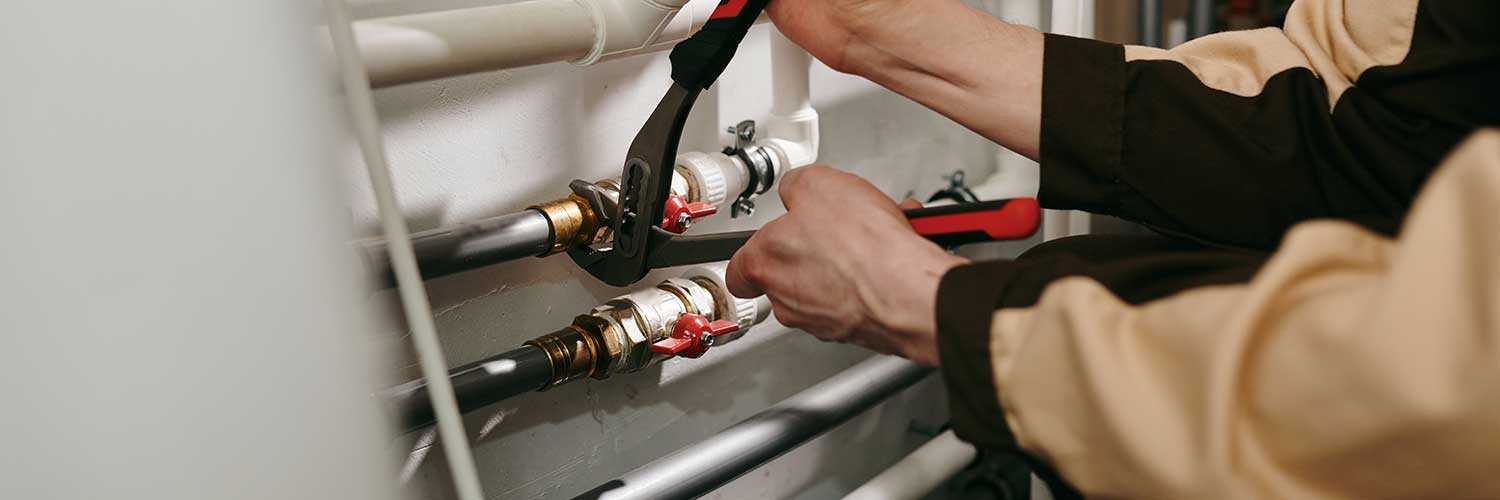 A plumber preparing for the finish plumbing phase of a new construction project