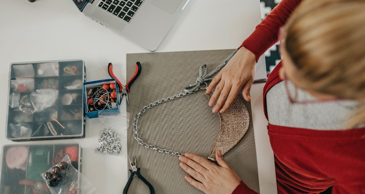 Intended mother making jewelry as a side hustle, to bring in extra income to raise the funds for surrogacy