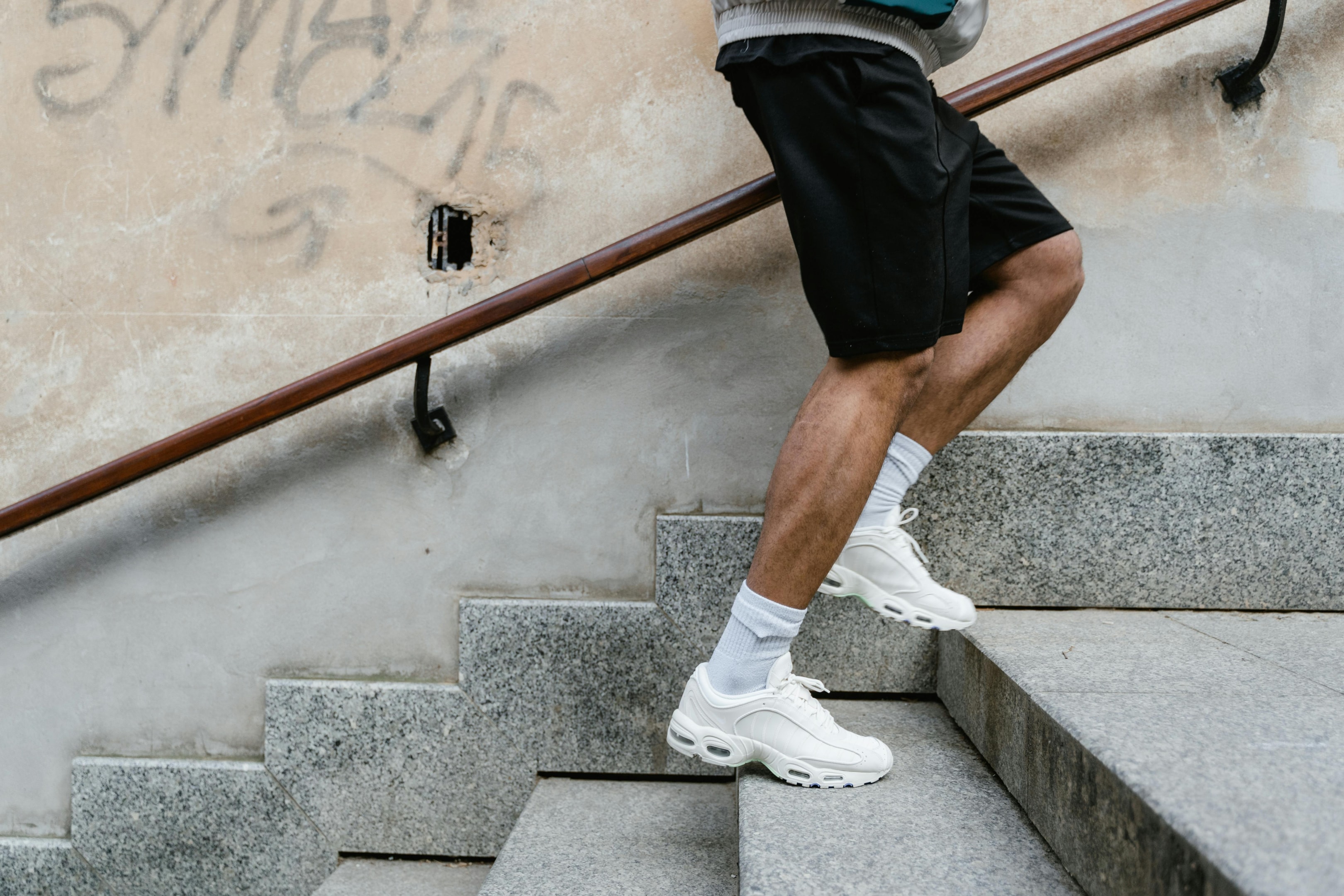 Photo by MART  PRODUCTION: https://www.pexels.com/photo/a-person-climbing-up-the-stairs-7879922/