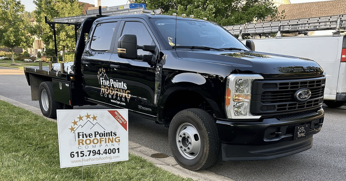 Five Points Roofing truck with insurance claim yard sign, showcasing full-service support from inspection to replacement.