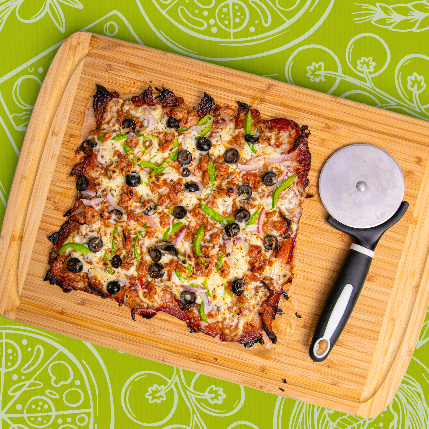A savory flatbread pizza with cheese, fresh olives, and crunchy green peppers