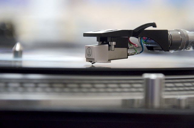 A person creating a custom vinyl record