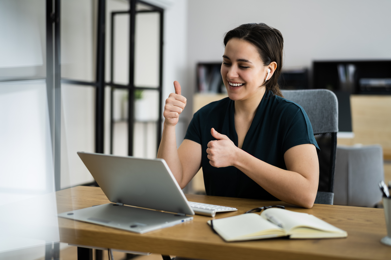 Manager giving positive feedback on a video call.