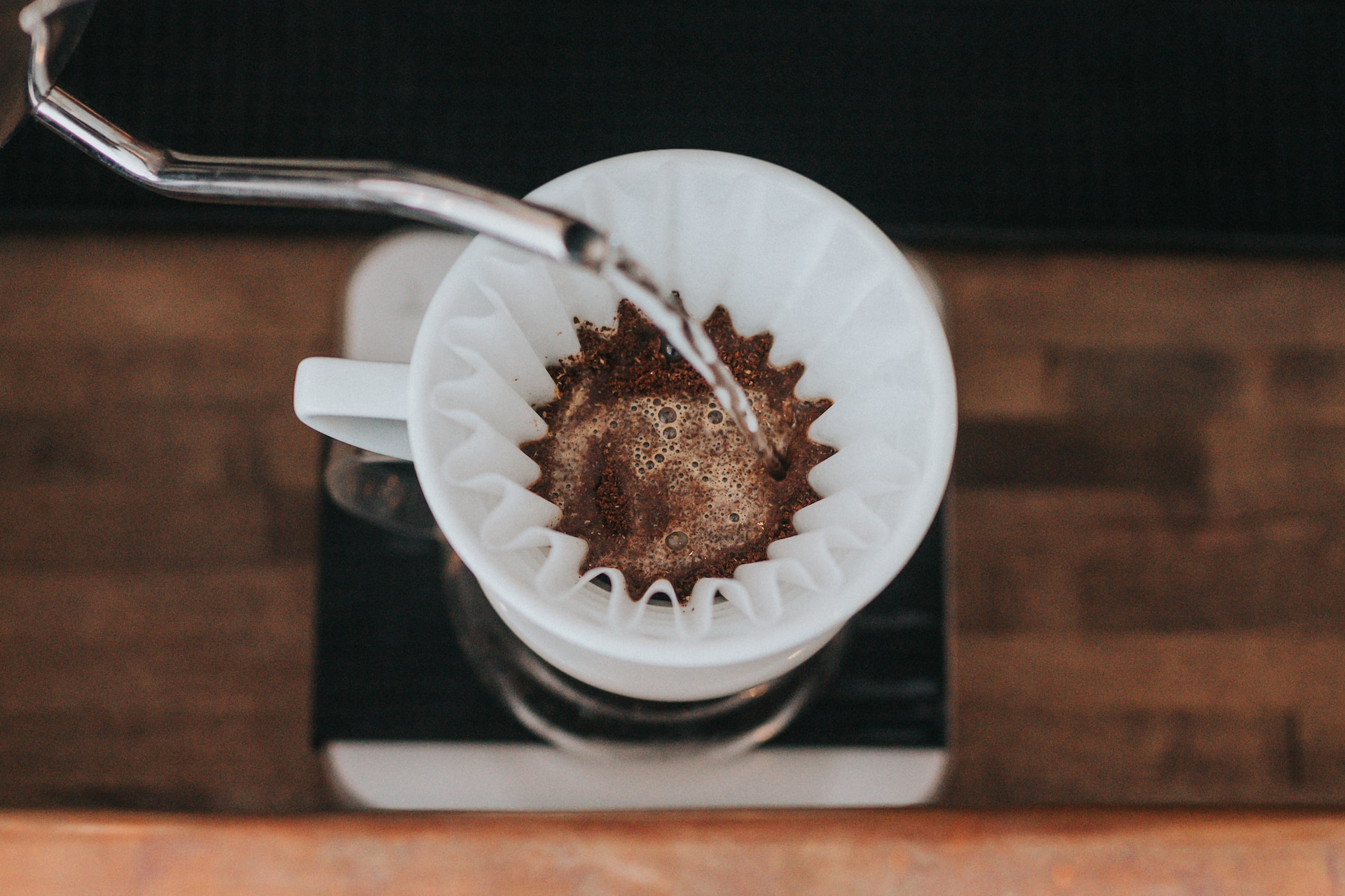 A top-down shot of a pour cover coffee filter in action.