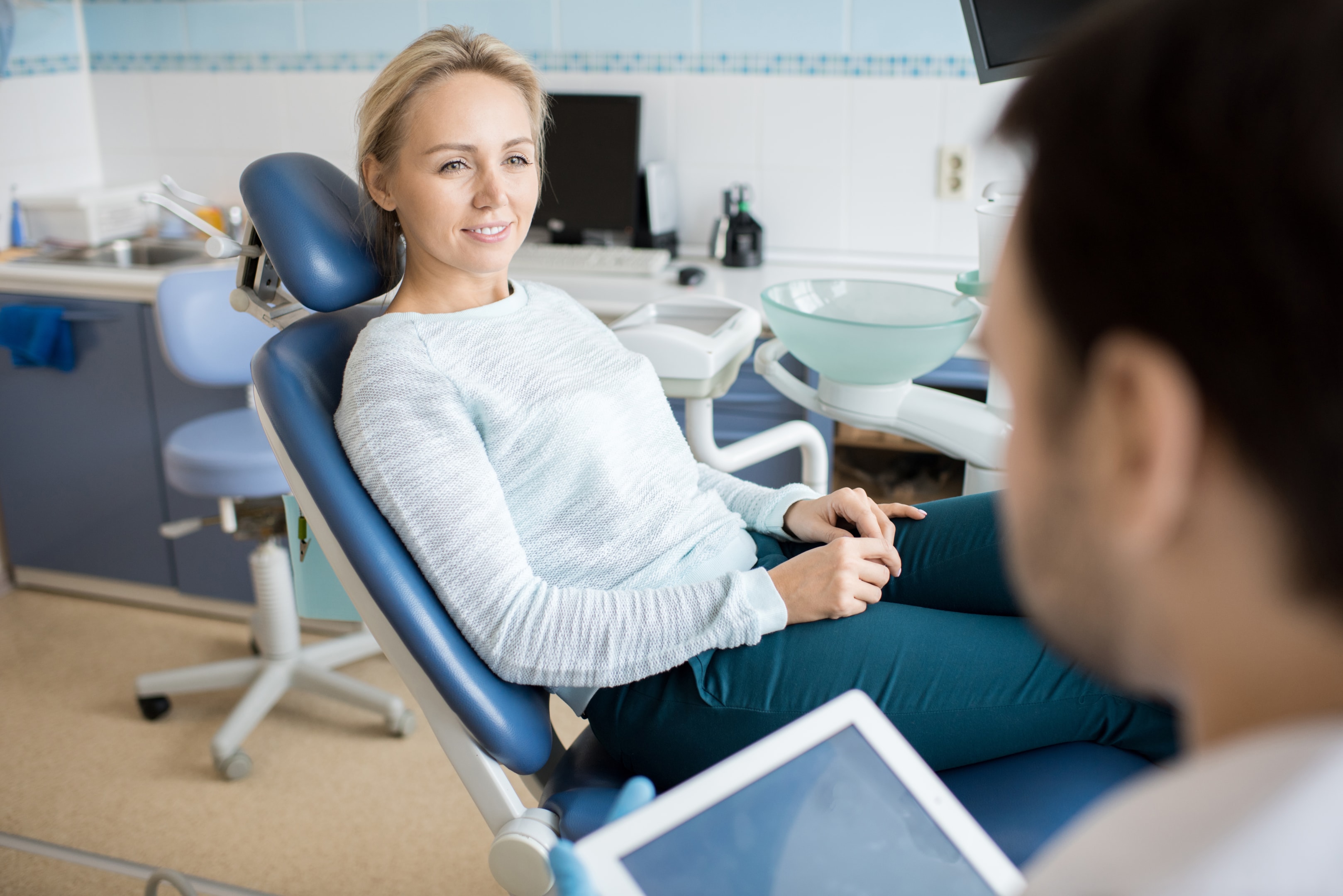 Woman sitting in chair asking a professional can a deviated septum cause sleep apnea?