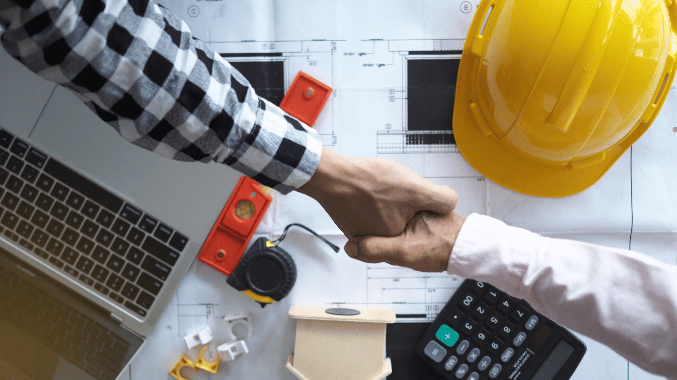 Handshake between a contractor and a property owner, representing a responsible partnership for house renovations and property management.