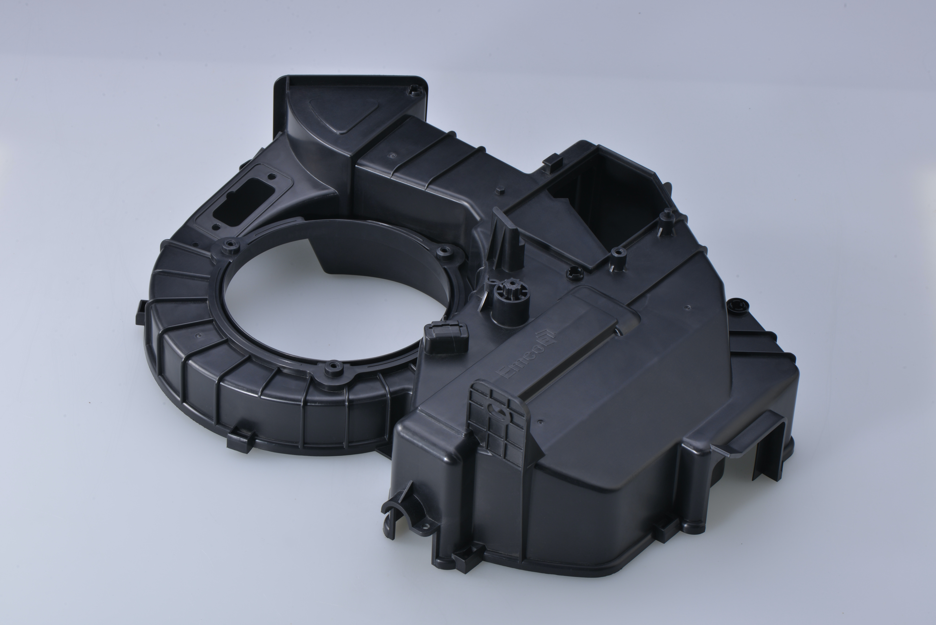 Black plastic injection molded part.