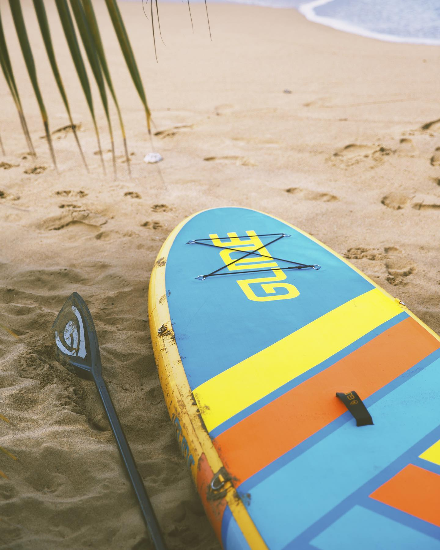 inflatable paddle board on the beach