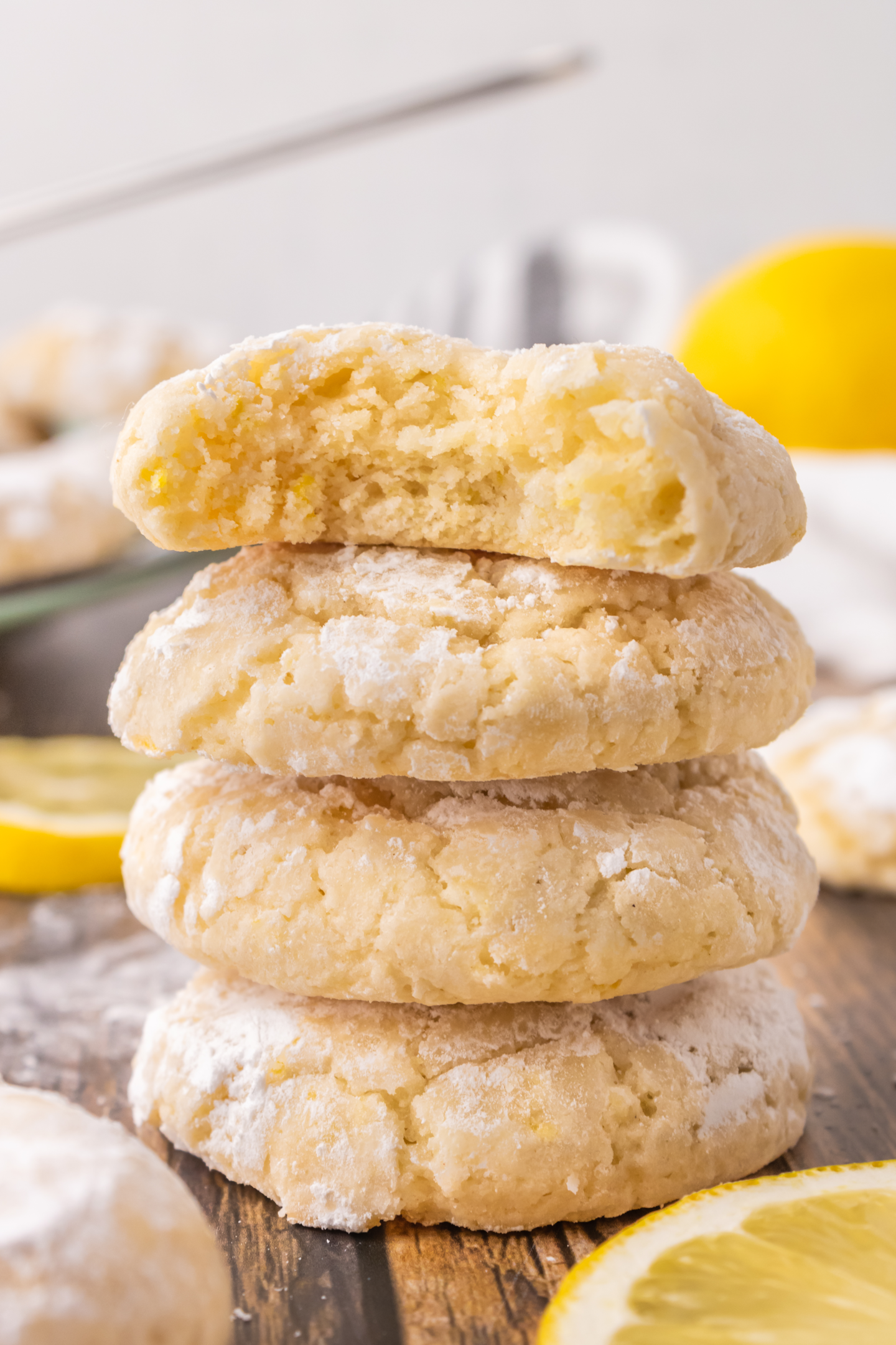 four lemon cookies stacked on top of each other