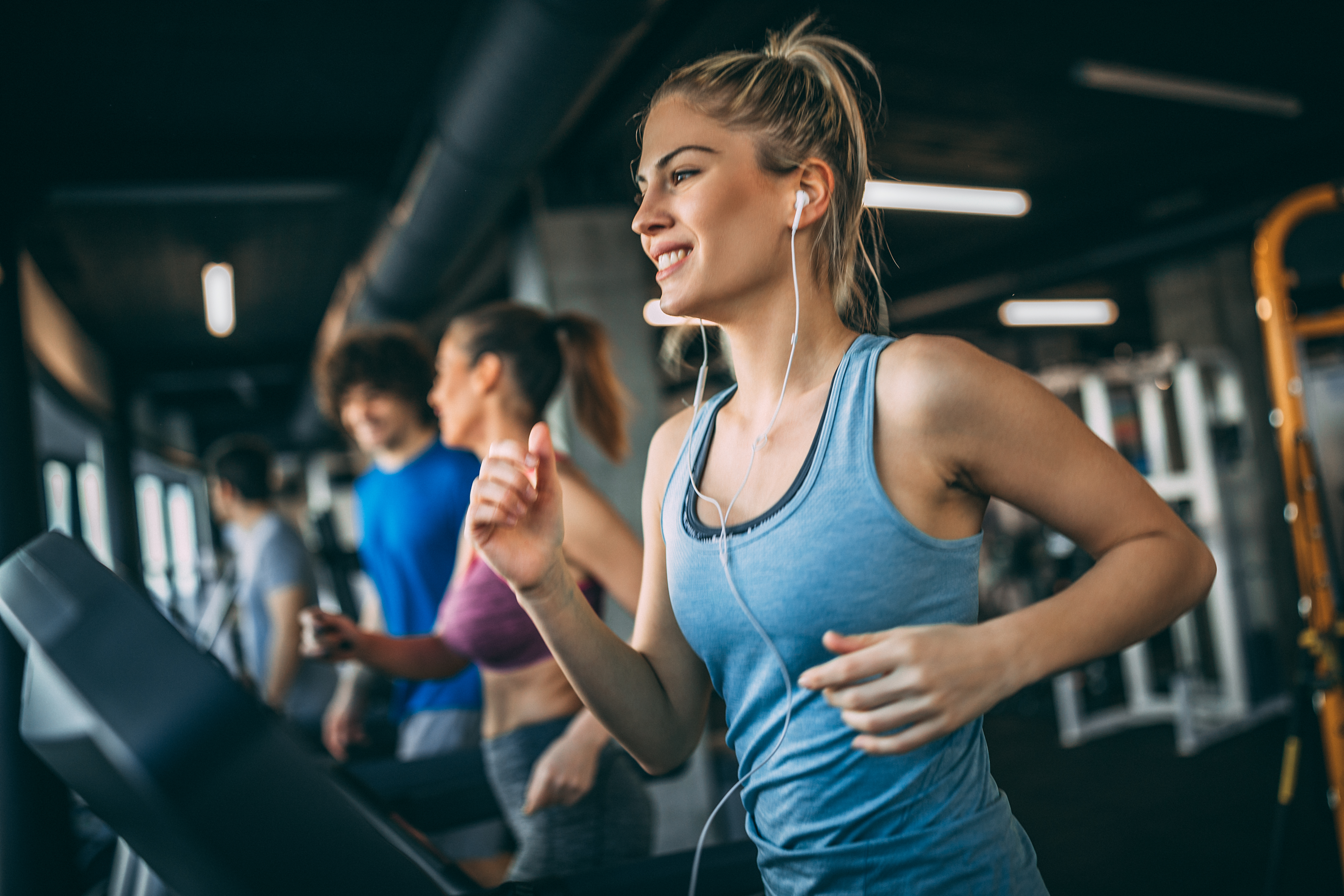 Young People Running on a Treadmill (Shutterstock)