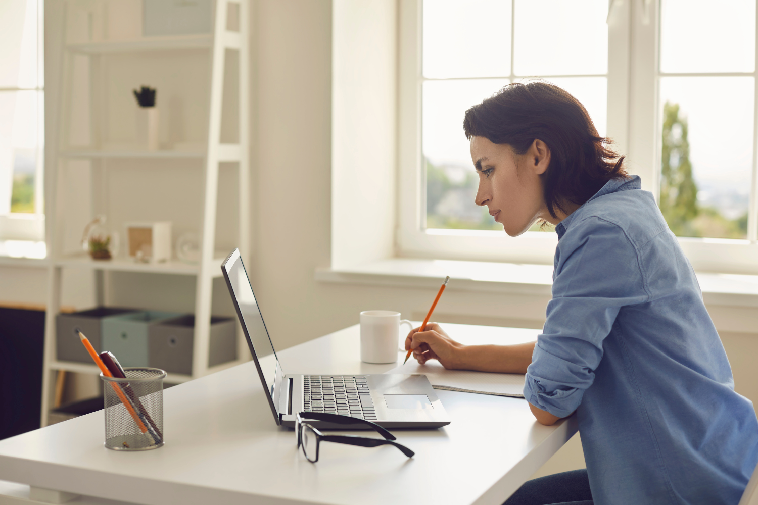 A US business founder on her laptop.