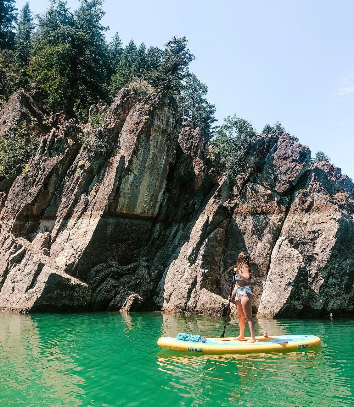 woman on an inflatable paddle board